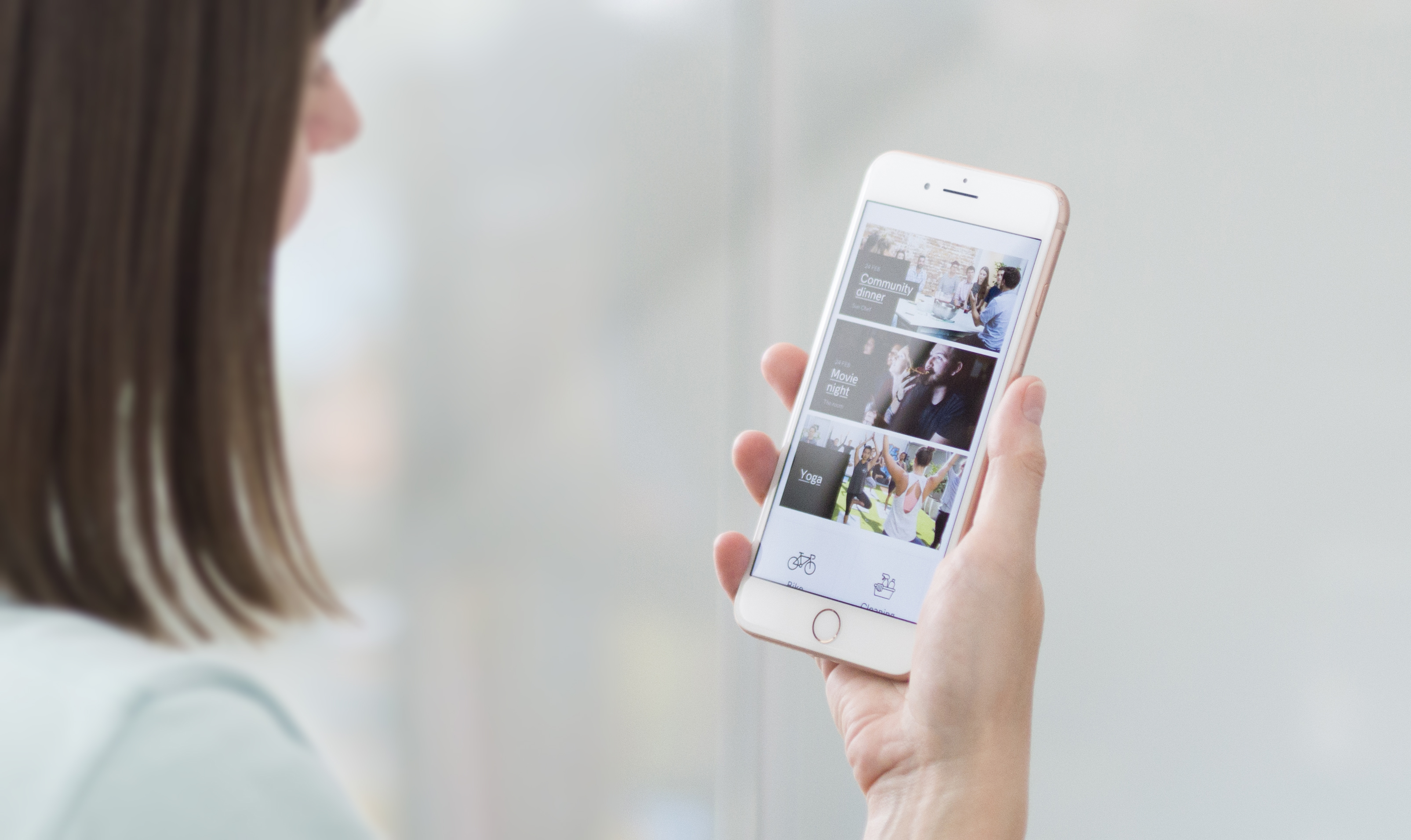 Girl is holding a phone with oppened UKO app on the Location page
